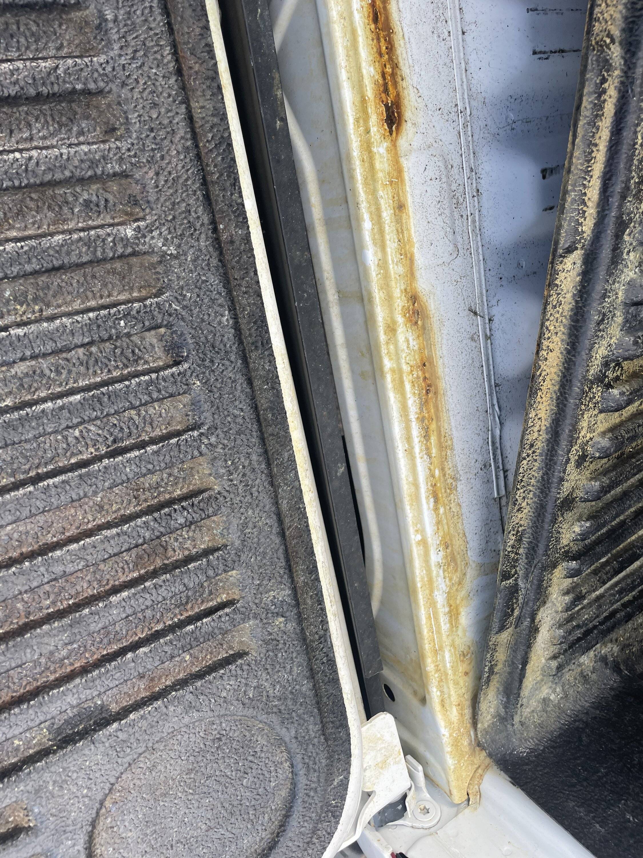 Rust at end of bed liner. Truck only has been registered for 1.5 years ...